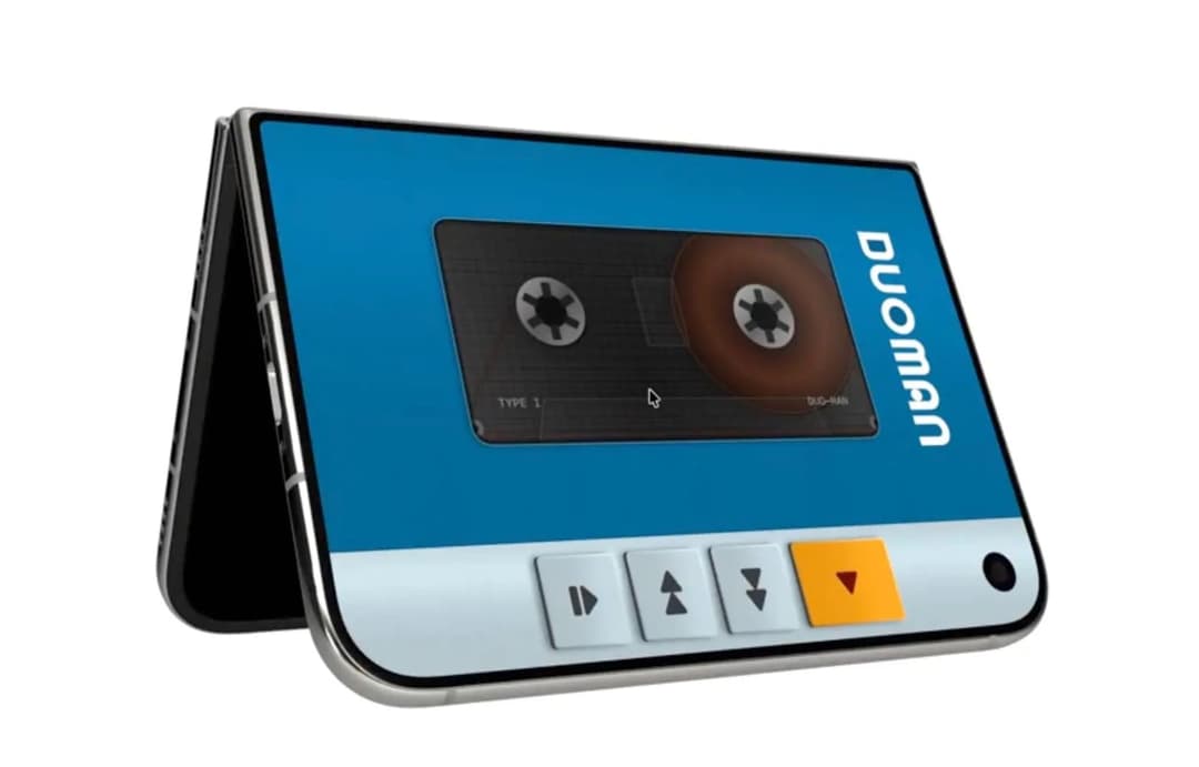 The image shows a foldable smartphone with a blue and white color scheme. The phone is angled slightly to the right, revealing its sleek black edges and silver trim. The screen displays a cassette player interface, featuring a brown cassette tape with a white label that reads "duoman" and "BU-HAN". The phone's screen a