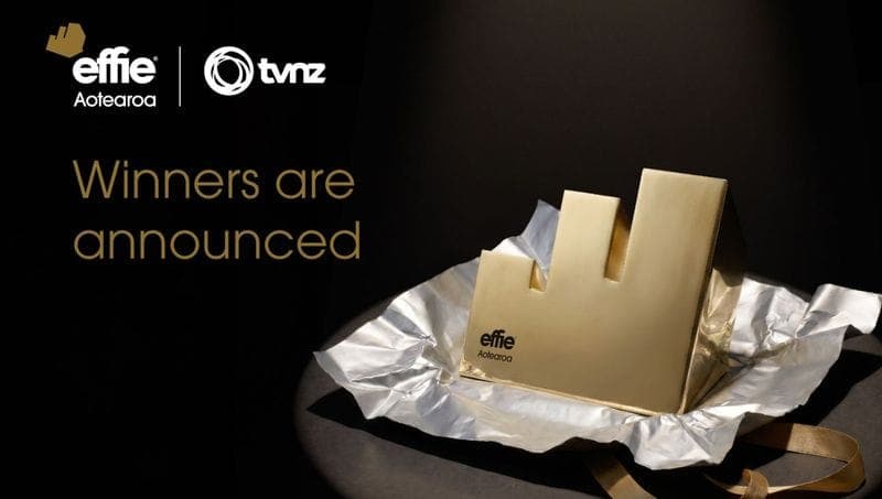 Effie Aotearoa and TVNZ logos on a black background with the text "Winners are announced" beside a gold, geometric trophy resting on crumpled silver foil with a gold ribbon.