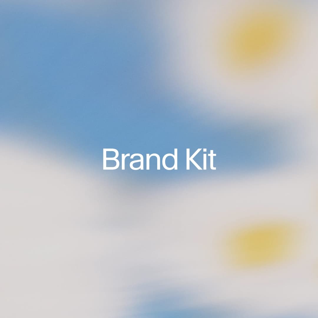 The image presents a digital illustration of a brand kit. The kit is designed in a gradient of blue and white, with a yellow circle in the top right corner. The kit is centrally positioned against a blurred background that appears to be a sky with clouds. The kit is white with a thin black outline. The image is a digit