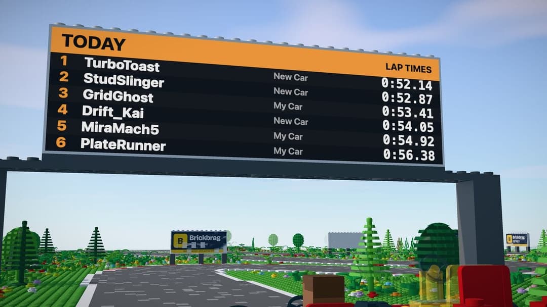 The image depicts a vibrant Lego race track with a large orange sign displaying the day's events, including the lap times for each car. The sign is mounted on a black pole and is situated in a lush green area with trees and bushes. The track itself is a complex maze of black and white lines, with a few cars visible, in