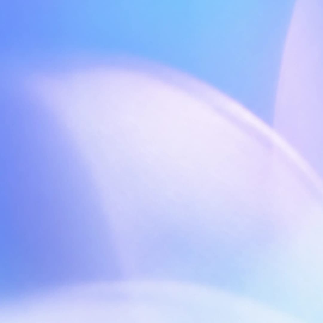 The image presents a soft, abstract composition dominated by a gradient of blue and white. The blue forms the backdrop, transitioning from a darker shade at the top to a lighter shade at the bottom. The white, on the other hand, is a lighter shade of blue and is primarily concentrated in the center of the image. The im