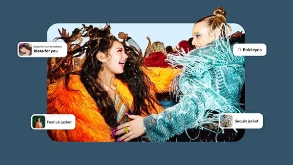 The image shows two women in a vibrant, possibly music-related, setting. The woman on the left is wearing an orange fur coat and has long, dark hair styled in a messy updo. The woman on the right is wearing a teal or turquoise sequined jacket and has her hair styled in a bun. Both women are smiling and appear to be int