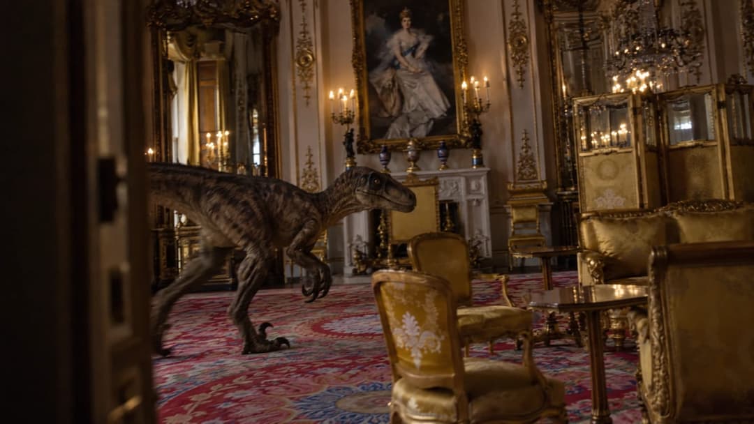 The image depicts a grand room with a large painting of a woman in a blue dress and a crown on the wall. The room is ornately decorated with gold accents, including a large mirror and a chandelier. A large dinosaur statue, possibly a Velociraptor, is positioned in the center of the room, walking towards the viewer. The