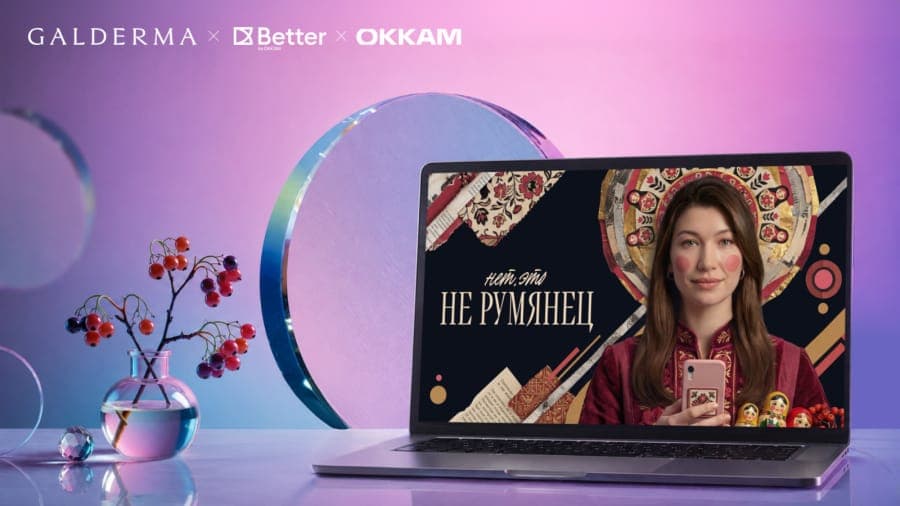 The image shows a laptop computer placed on a reflective surface, possibly glass or a mirror, with a vase of red berries and a small glass vase of water nearby. The laptop screen displays a video of a woman in a red dress holding a pink phone, with the text "��е ��римени �� ������������������" (I'm going to call you) v