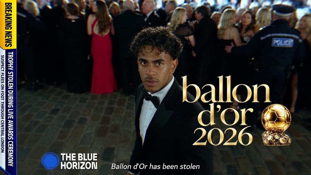 The image is a promotional poster for the movie "Ballon d'Or 2026". The central figure is a man in a black tuxedo, standing in front of a crowd of people. The crowd is dressed in formal attire, suggesting a formal event. The background is blurred, drawing focus to the man in the tuxedo. The poster features a gold-color