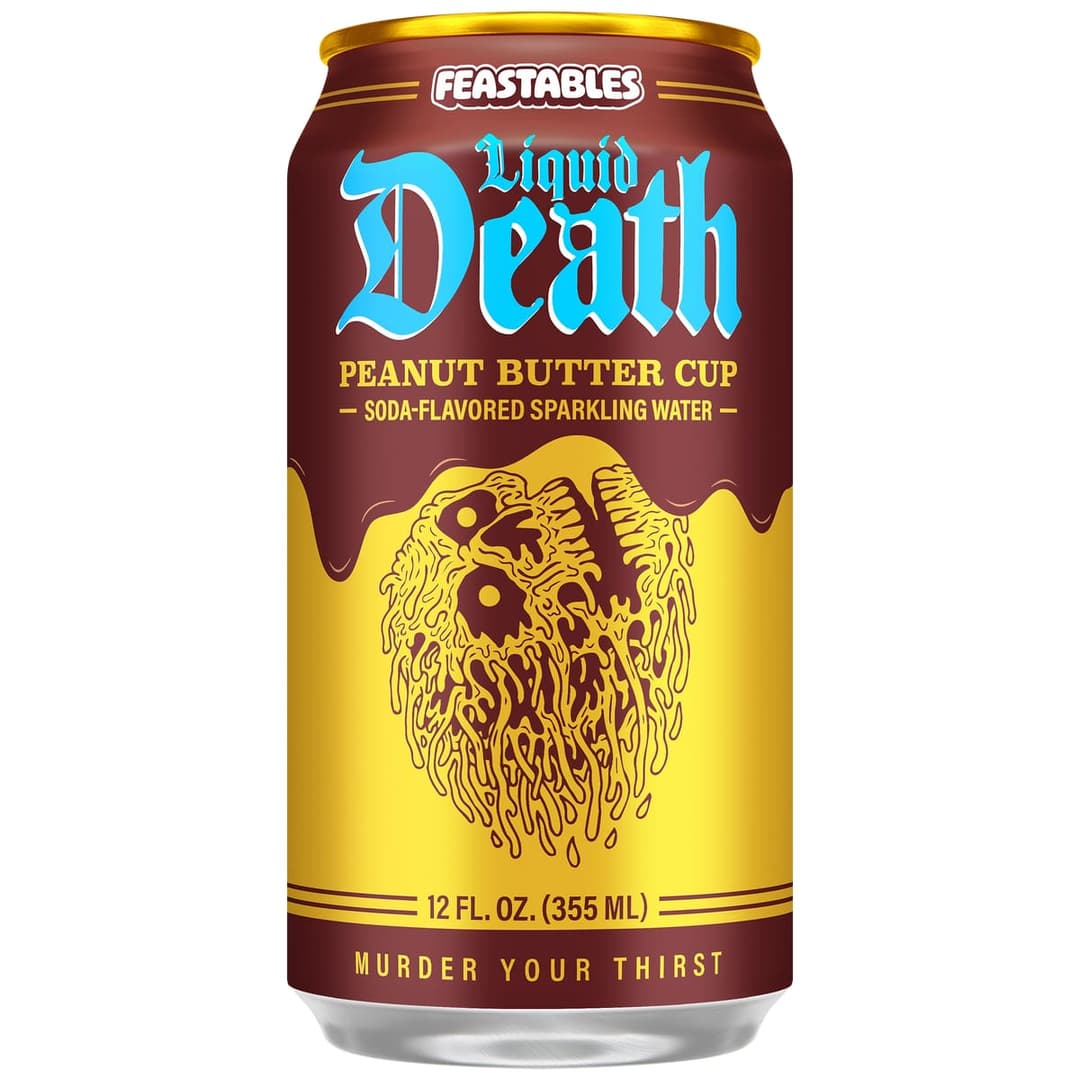 The image shows a can of Feastables Liquid Death Peanut Butter Cup soda. The can is predominantly red and gold, with a gold top. The text "Feastables Liquid Death Peanut Butter Cup" is prominently displayed in blue and gold. The can features a gold design of a peanut butter-like substance spilling out of a circular sha