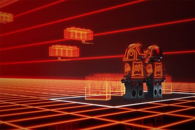 The image presents a scene from a video game, set in a futuristic environment. The backdrop is a grid of red lines, reminiscent of a classic video game setting. Two Lego figures, each with a unique design, stand in the center of the image. The figures are primarily orange and black, with some orange details. The figure