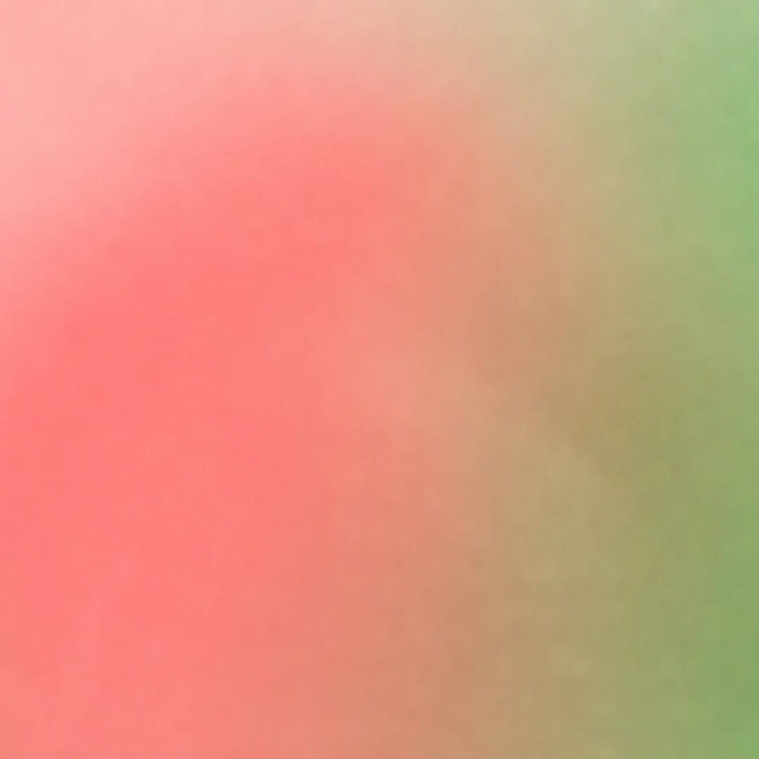 The image presents a gradient of pink and green hues, transitioning from a lighter pink at the top to a darker green at the bottom. The colors blend smoothly, creating a soft and undefined border. The image is devoid of any discernible objects, actions, or text, and is devoid of any human or animal features. The colors