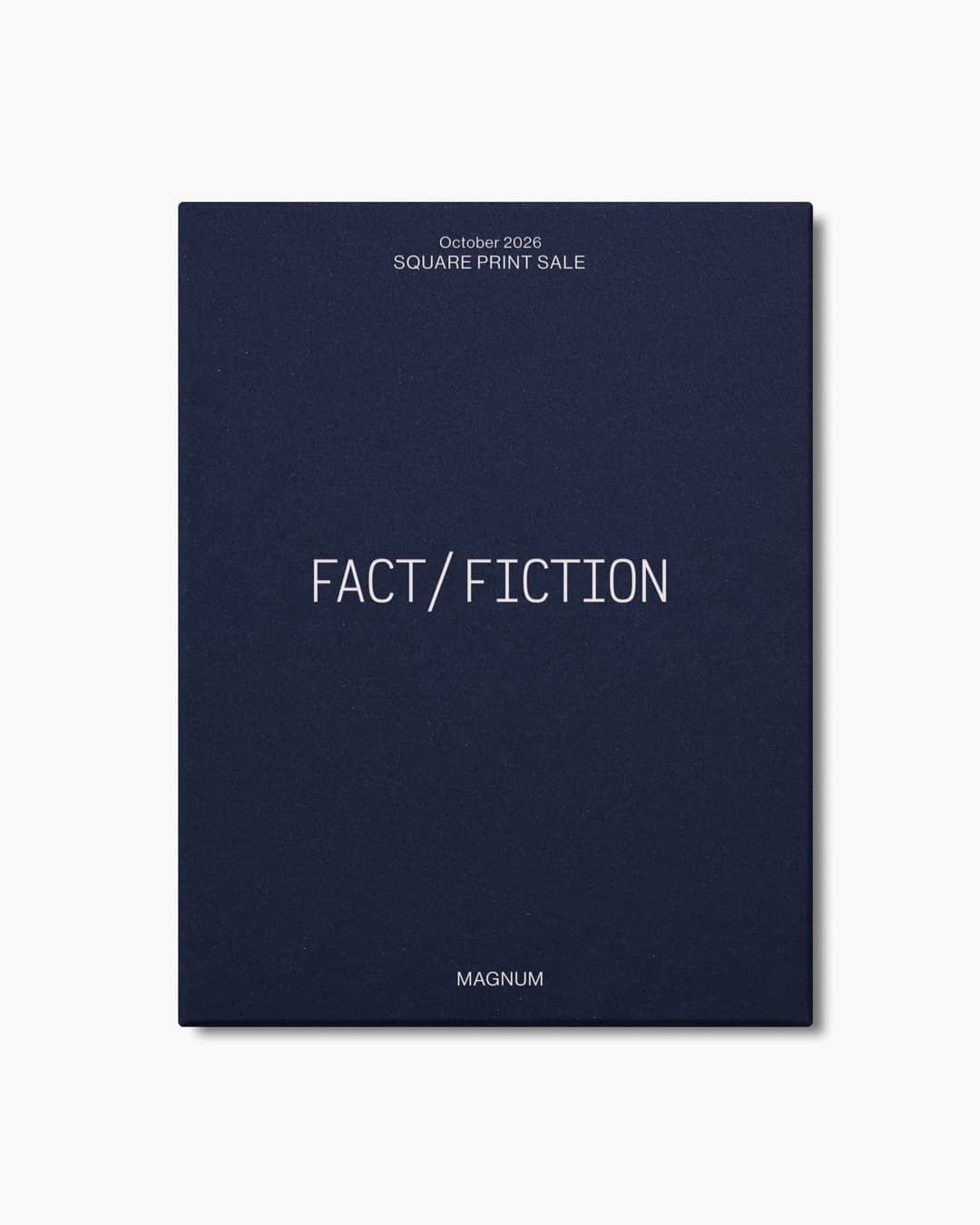 The image shows a navy blue book cover with a textured surface. The cover features the title "FACT/FICTION" in a light gray or silver font, centrally positioned. Above the title, the text "October 2026 SQUARE PRINT SALE" is printed in a smaller, lighter gray or silver font. At the bottom of the cover, the word "MAGNUM"