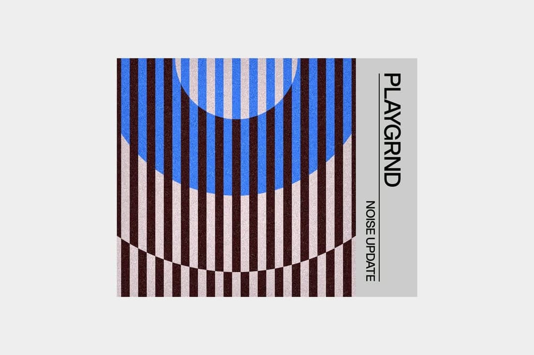 The image presents a digital art piece titled "Playgrind Noise Update". The artwork is composed of vertical stripes in shades of brown and beige, arranged in a repeating pattern. A large blue circle is positioned centrally, with a smaller blue circle partially overlapping it. The background is a light gray color. The t