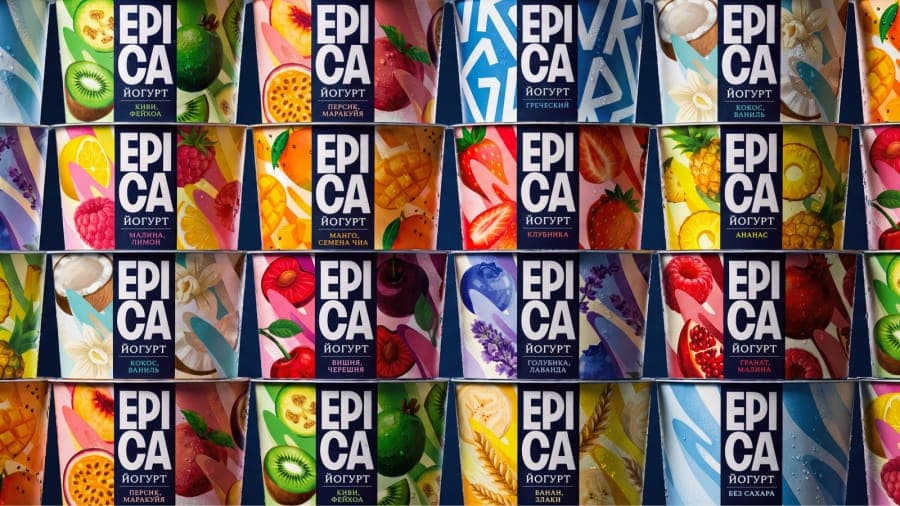 The image presents a grid of twelve identical containers of EpiCasa yogurt, arranged in four rows and three columns. Each container is adorned with a vibrant illustration of various fruits and vegetables, including kiwi, strawberries, mango, pineapple, and raspberries, creating a lively and colorful display. The contai