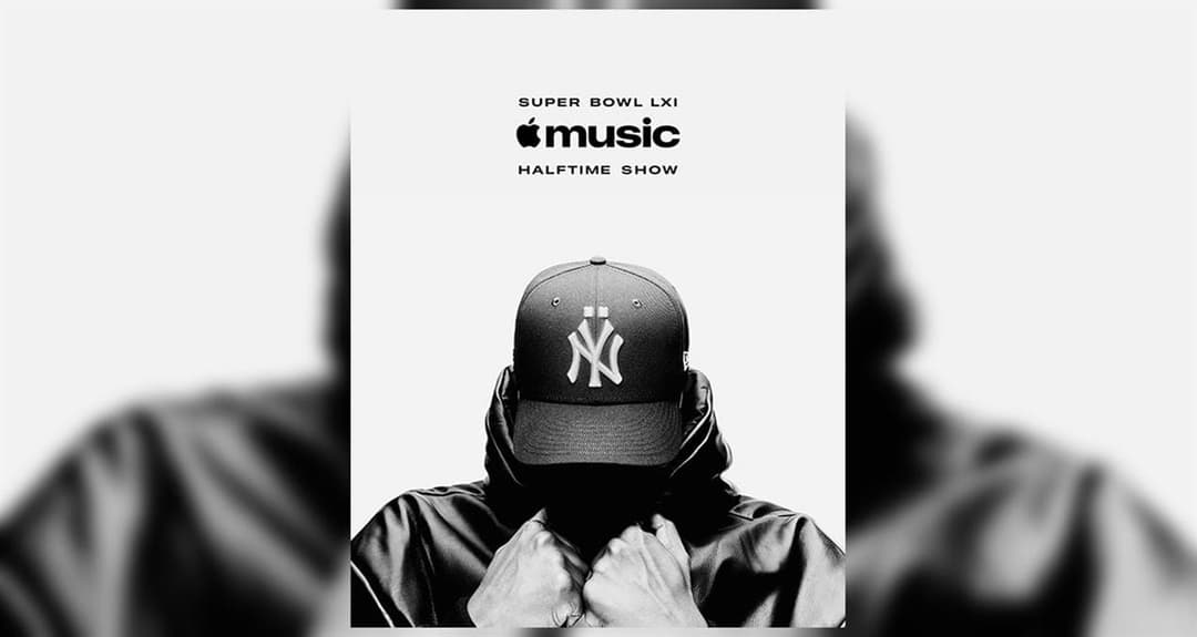 A black-and-white promotional poster for the Super Bowl LXI Apple Music Halftime Show, showing a person in a New York Yankees cap and a hooded leather jacket with the face hidden. Visible text reads "SUPER BOWL LXI", the Apple Music logo, and "HALFTIME SHOW".