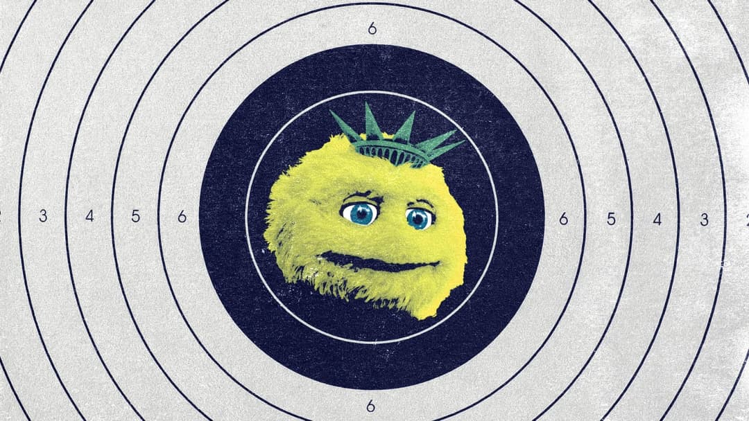 An illustration of a fuzzy yellow face wearing a green Statue of Liberty crown is centered on a navy and white shooting target with numbered rings.