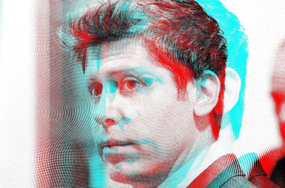 The image presents a close-up portrait of a man, rendered in a 3D style with a halftone dot pattern. The man's hair is styled in a classic pompadour, and his gaze is directed to the left. The image is rendered in a 3D style with a halftone dot pattern, giving it a textured appearance. The man's skin tone is light, and