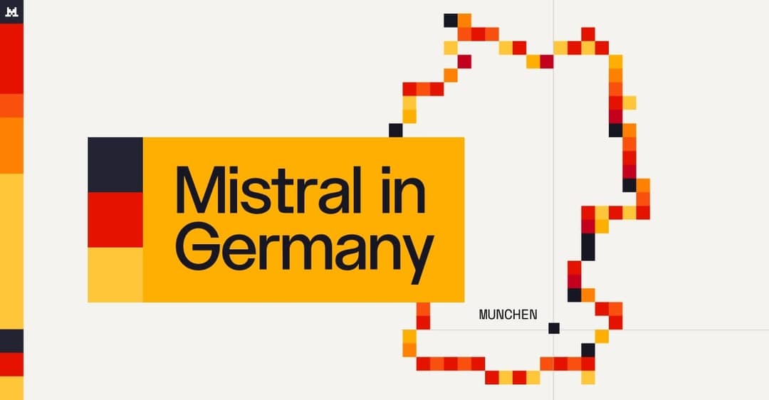 The image presents a stylized map of Germany, composed of small, pixelated squares in shades of red, orange, yellow, and black. The map is outlined in black and is set against a white background. The word "München" is written in black text at the bottom right corner of the map. The map is not a perfect rectangle but ha