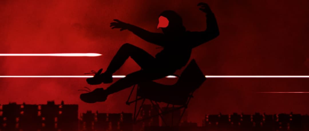 The image depicts a solitary figure in a black hoodie and pants, wearing a red mask, suspended in mid-air above a cityscape. The figure is positioned in a black folding chair, with their arms outstretched and legs bent at the knees, suggesting a sense of motion. The cityscape, rendered in shades of red and orange, form