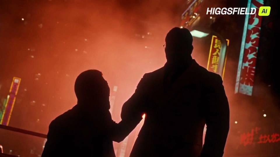The image shows two silhouetted figures standing in front of a vibrant red and orange cityscape at night. The figure on the left is wearing a dark suit and appears to be reaching out towards the other figure. The figure on the right is wearing a dark suit and is facing away from the left figure. The background is fille