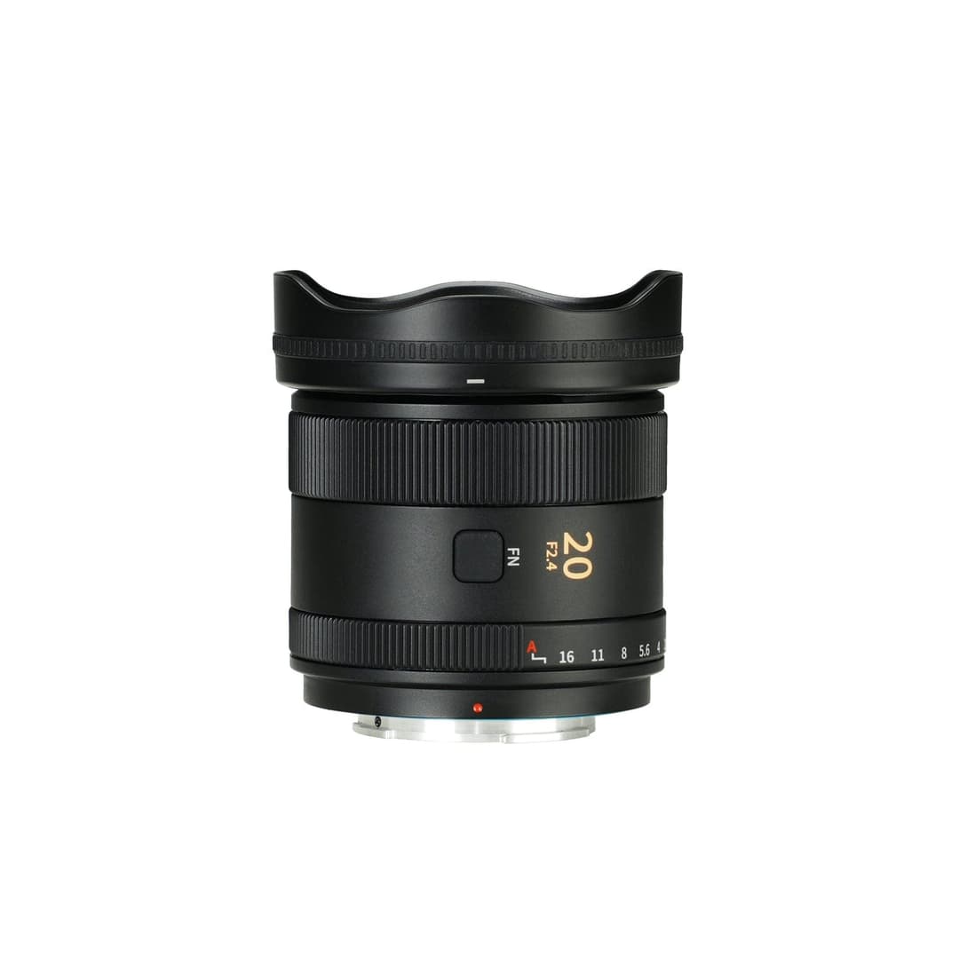 A black 20mm F2.4 wide-angle lens with a petal-shaped lens hood on a white background; the barrel shows "20 F2.4" in orange, an FN button, and an aperture scale marked 16, 11, 8, 5.6, 4.