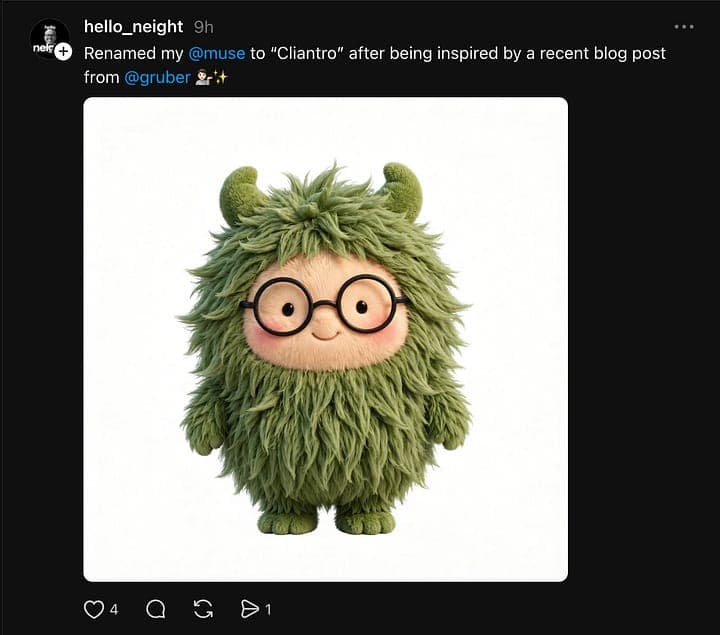 The image shows a plush toy character with a green, furry body and large, round glasses. The character has two small, pointed horns on its head and a small, round nose. It is standing upright on two legs and has a friendly expression. The character is set against a white background. The image is a screenshot of a Twitt