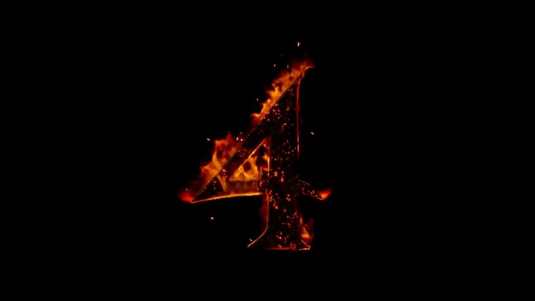The image presents a striking contrast of black and orange hues. Dominating the center of the image is the number "4", which is ablaze with vibrant orange flames. The flames, with their flickering and dancing forms, add a sense of movement and energy to the otherwise still image. The background is a stark black, provid