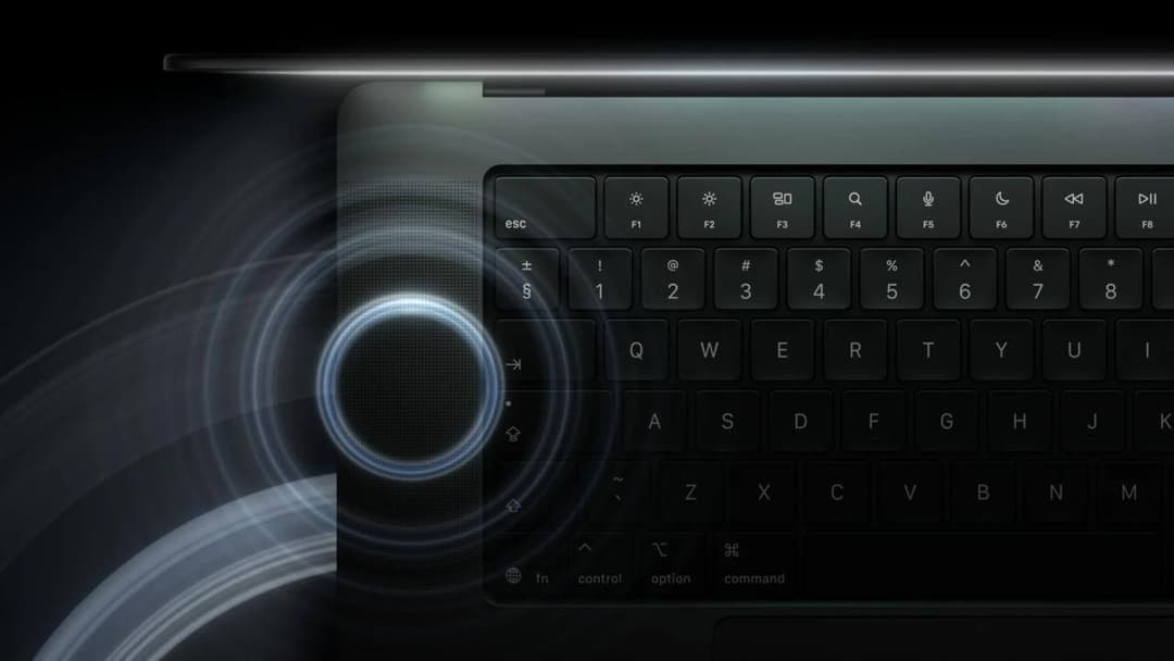 A close-up of a laptop keyboard shows a glowing Touch ID button at the top right with concentric wave rings, alongside keys labeled esc, F1 to F8, control, option, and command. The black background and blue-white light give it a product-promotional look.