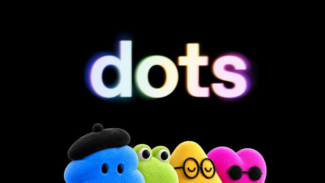 The image features four plush toys against a black background. The toys are positioned in a row, with the first one wearing a black beret and the second one wearing a pair of black glasses. The third toy is a vibrant yellow, and the fourth is a cheerful pink heart. The word "dots" is prominently displayed in the center