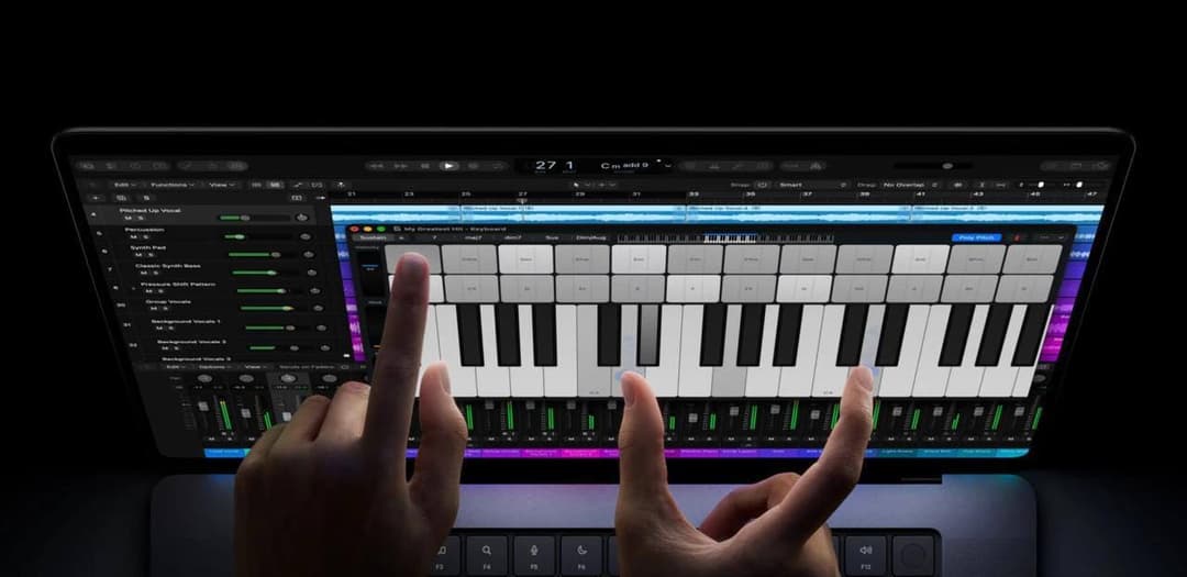 A laptop screen shows a digital audio workstation with tracks, a mixer, and an on-screen piano keyboard, with the header reading "My Greatest Hit - Keyboard" and "Cm add 9". Two hands play the keys, and the function-key row (F3 to F12) is visible below.